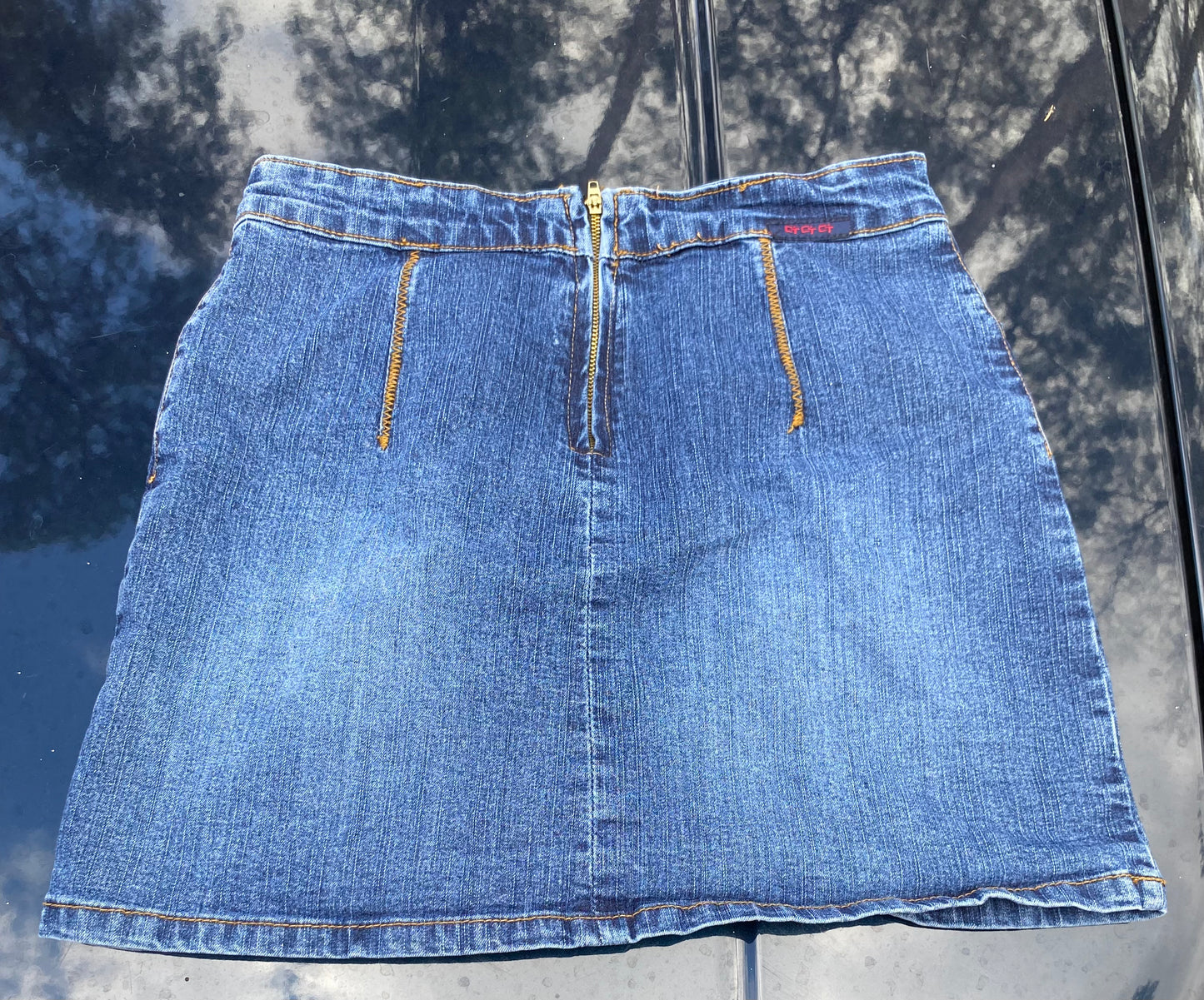 Pleaded denim mini skirt